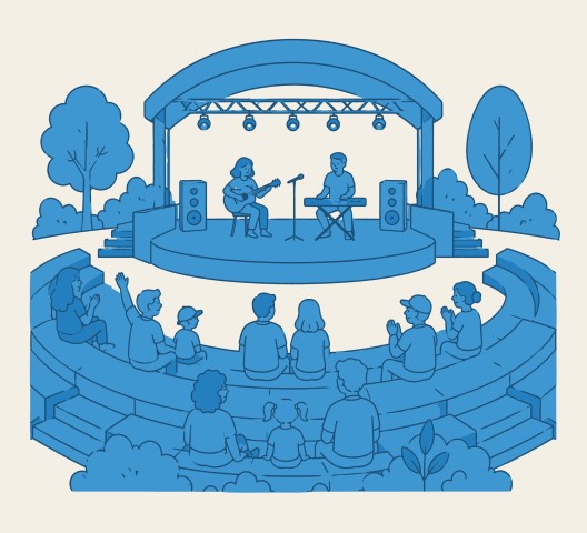 Musical performance on outdoor amphitheater stage with audience.